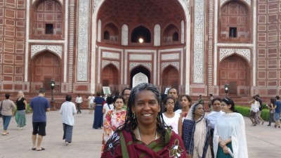 Ms. Foss in front of the entrance building to the Taj Mahal