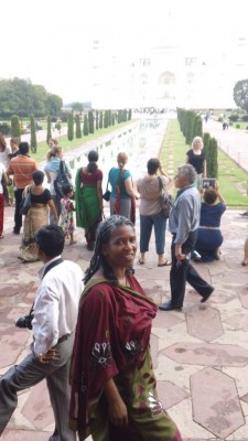 Ms. Foss after walking through the entry building. Standing in front of the water leadng to the Taj Majal